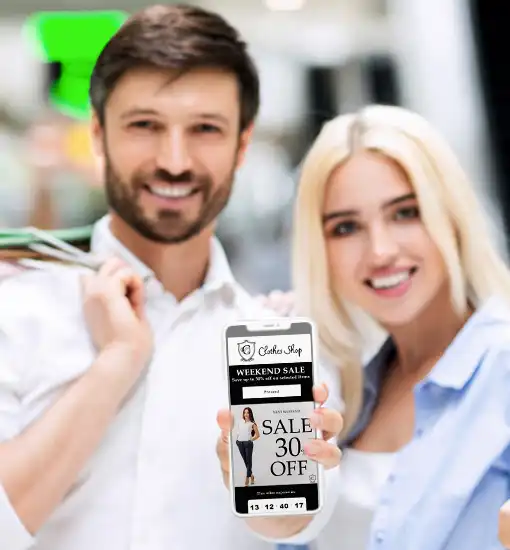 Happy people holding smartphone with Digital Clothing Coupon for shopping centers.